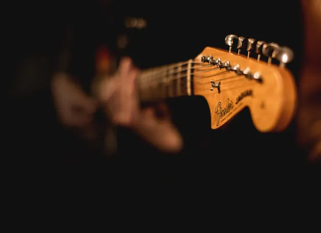 A man playing a guitar