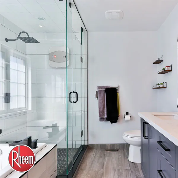A bathroom with an electric storage water heater mounted on the wall