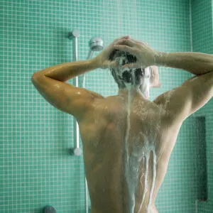 A man is enjoying electric water heater in Singapore