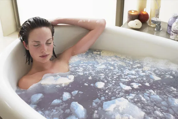 a woman enjoys bathing in a hot water