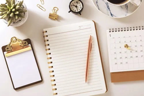 A note, a book, and a calendar