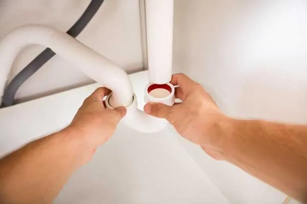 A man inspection a pipe
